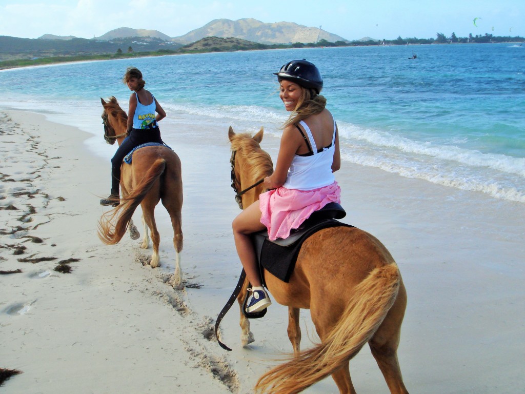 Africah Horse-back riding on the beach.